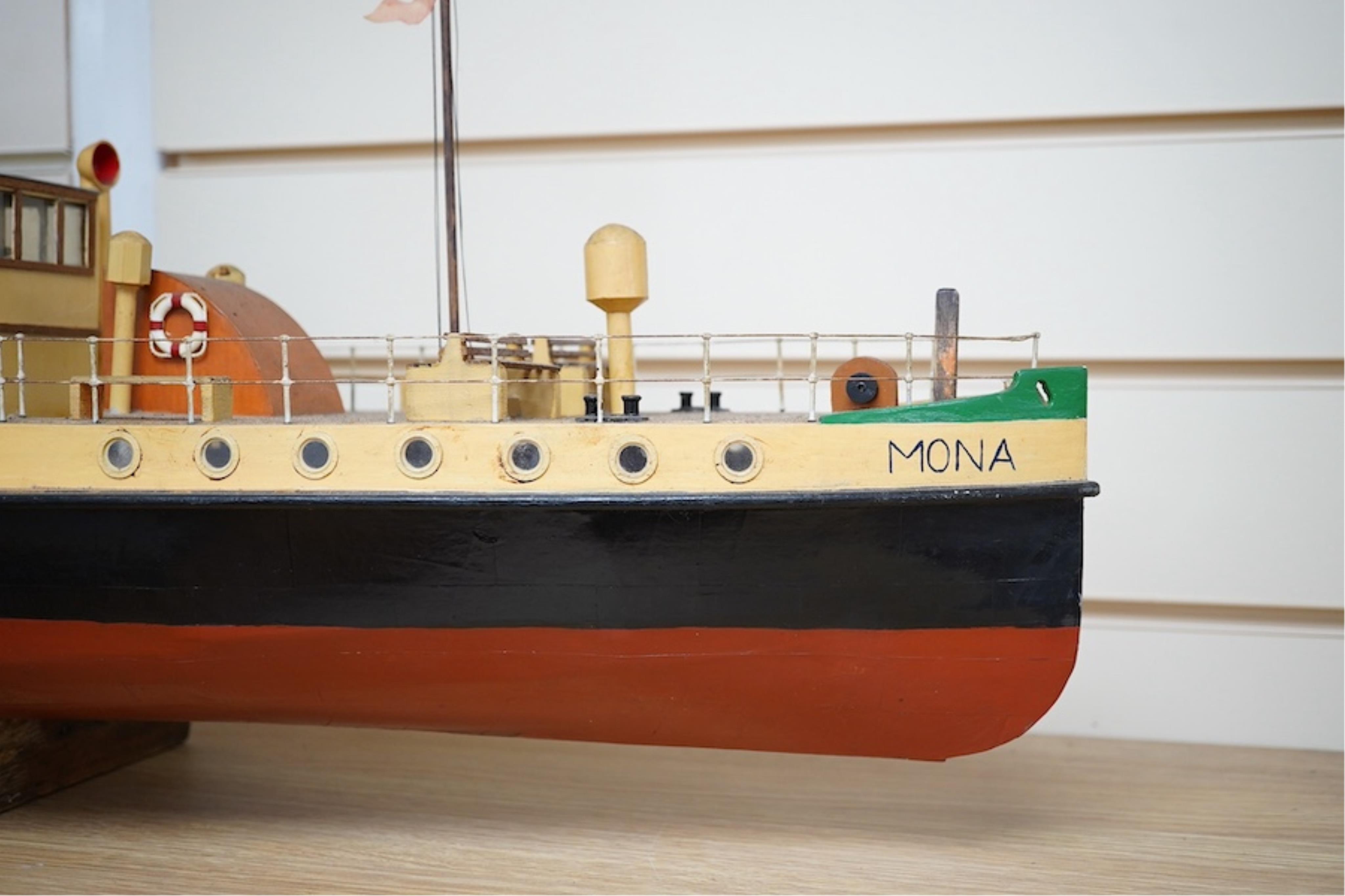 A scratch built model of an Isle of Man steam passenger ferry, 'Mona', of wood, card and plastic construction, powered by two electric motors, hull 108cm long. Condition - fair